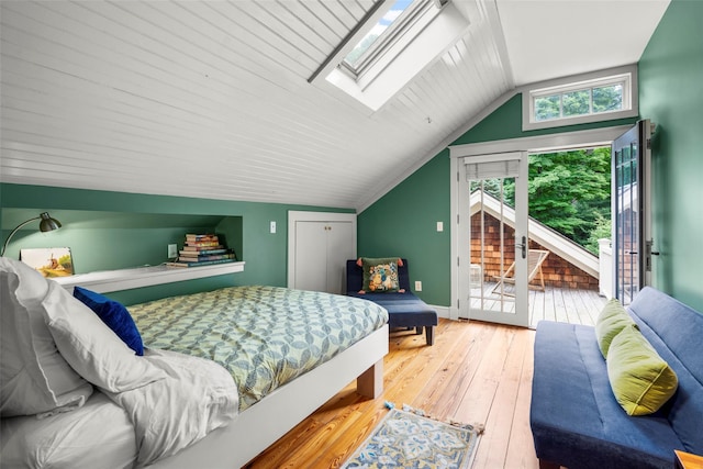 17 Half Moon Rdg, Cold Spring, NY 10516 - bedroom featuring access to outside, wood-type flooring, vaulted ceiling, and a skylight