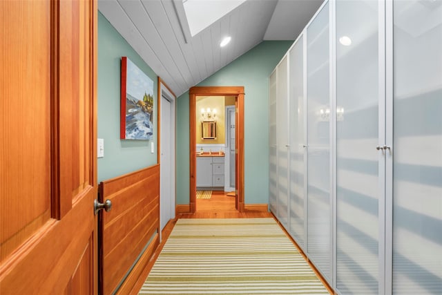 17 Half Moon Rdg, Cold Spring, NY 10516 - hall with lofted ceiling, a skylight, and light wood-style floors