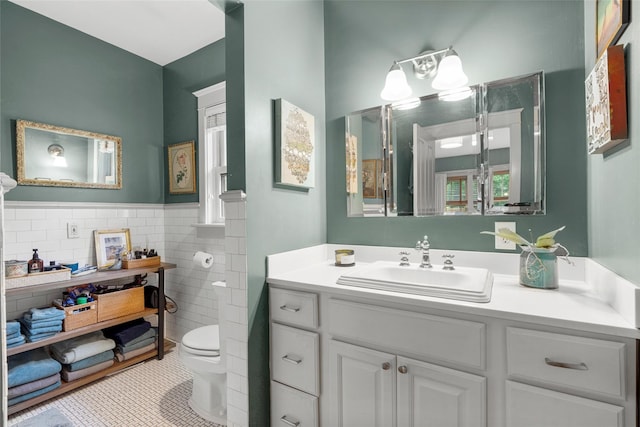 17 Half Moon Rdg, Cold Spring, NY 10516 - bathroom featuring tile walls, tile patterned floors, vanity, and wainscoting