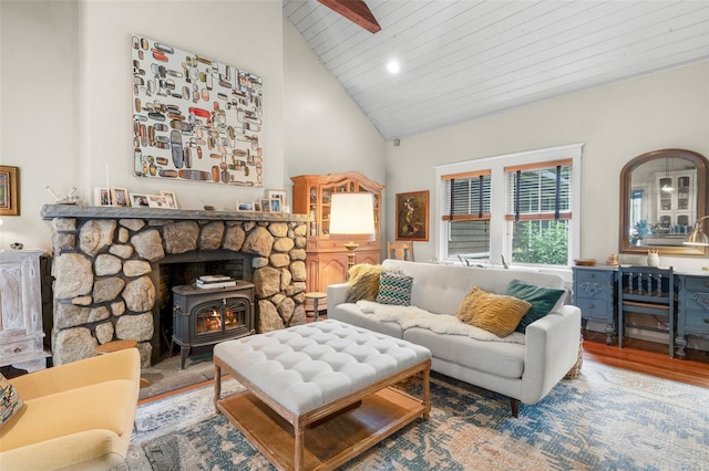 17 Half Moon Rdg, Cold Spring, NY 10516 - living area with a wood stove, high vaulted ceiling, wood finished floors, and a wooden ceiling with exposed beams