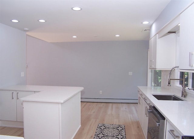 121 Lower Sheep Pasture Rd, East Setauket, NY 11733 - kitchen with stainless steel dishwasher, baseboard heating, white cabinets, light countertops, and recessed lighting
