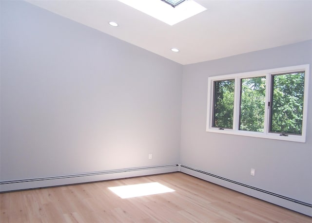 121 Lower Sheep Pasture Rd, East Setauket, NY 11733 - unfurnished room featuring light wood finished floors, a skylight, baseboard heating, and recessed lighting