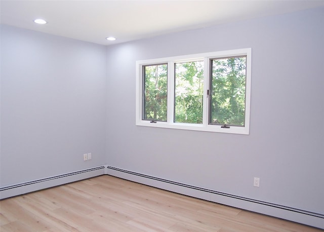 121 Lower Sheep Pasture Rd, East Setauket, NY 11733 - empty room featuring a baseboard radiator, light wood-style flooring, and recessed lighting