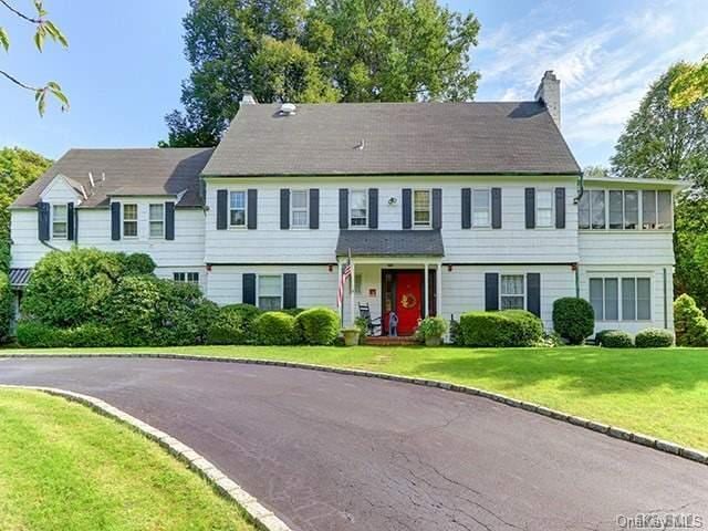 5 Kohlsaat Ct, Smithtown, NY 11787 - view of front of property featuring a chimney and a front yard