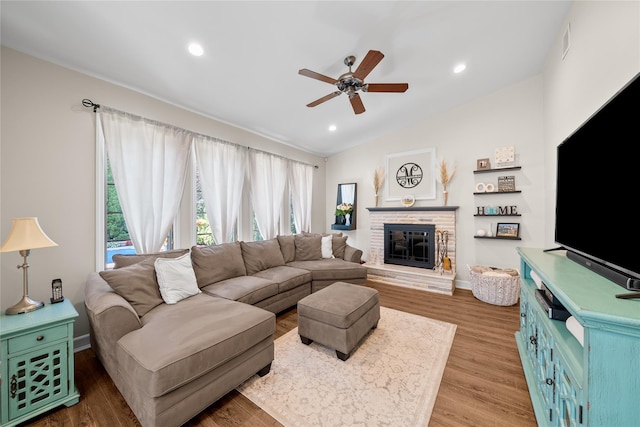 506 Kime Ave, West Islip, NY 11795 - living room with ceiling fan, vaulted ceiling, a fireplace, wood finished floors, and recessed lighting