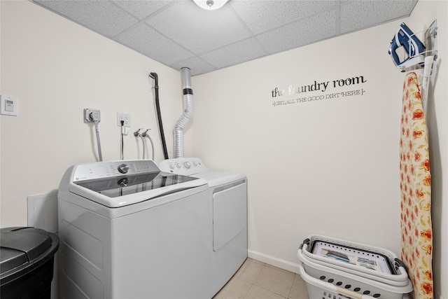 506 Kime Ave, West Islip, NY 11795 - laundry room featuring washer and clothes dryer and light tile patterned flooring