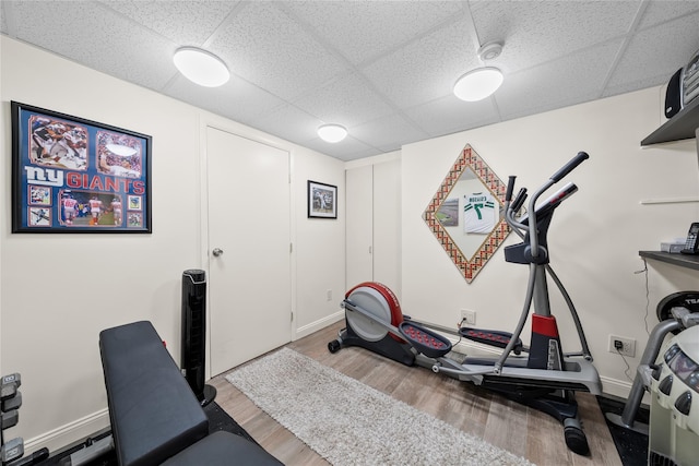 506 Kime Ave, West Islip, NY 11795 - workout room featuring a paneled ceiling and wood finished floors