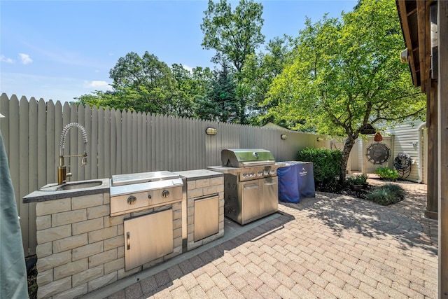 506 Kime Ave, West Islip, NY 11795 - fenced backyard with an outdoor kitchen and a patio area