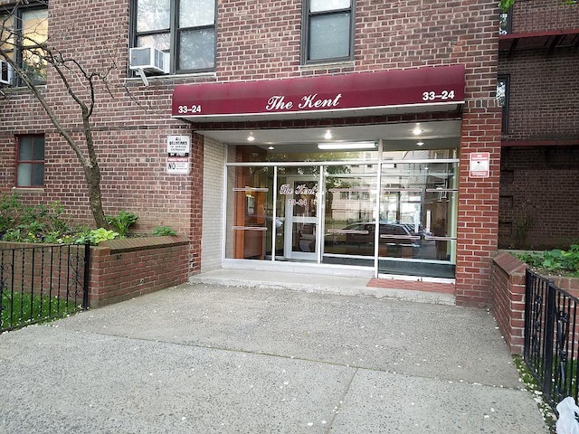 33-24 Junction Blvd Unit 6R, Jackson Heights, NY 11372 - doorway to property with brick siding and cooling unit