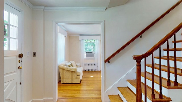 32 Biltmore Ave, Yonkers, NY 10710 - entryway featuring radiator heating unit, light wood finished floors, ornamental molding, and stairway