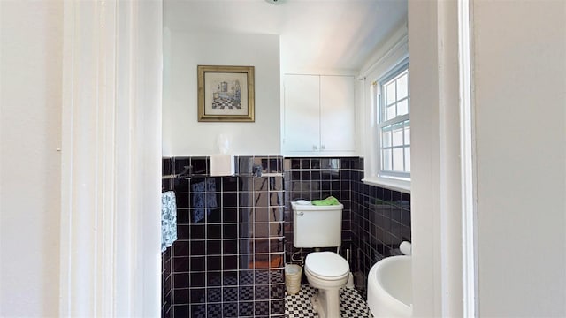 32 Biltmore Ave, Yonkers, NY 10710 - bathroom featuring tile walls, tile patterned flooring, and wainscoting