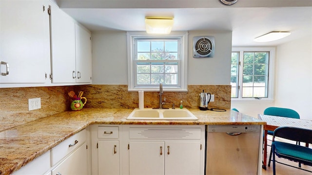 32 Biltmore Ave, Yonkers, NY 10710 - kitchen featuring stainless steel dishwasher, white cabinetry, tasteful backsplash, and light stone countertops