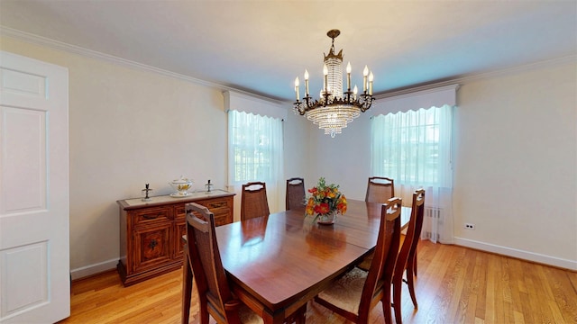 32 Biltmore Ave, Yonkers, NY 10710 - dining area with a chandelier, plenty of natural light, light wood-type flooring, ornamental molding, and radiator heating unit