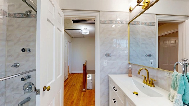 32 Biltmore Ave, Yonkers, NY 10710 - bathroom with vanity, wood finished floors, and tile walls