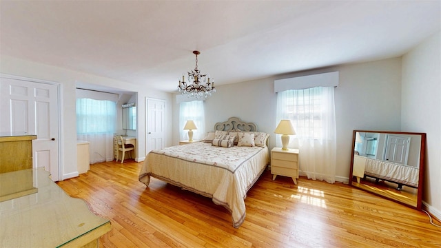 32 Biltmore Ave, Yonkers, NY 10710 - bedroom featuring a chandelier and light wood finished floors