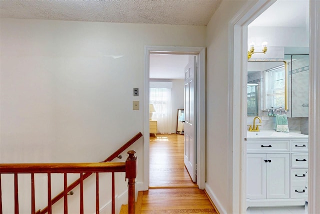32 Biltmore Ave, Yonkers, NY 10710 - hallway with light wood-type flooring and a textured ceiling