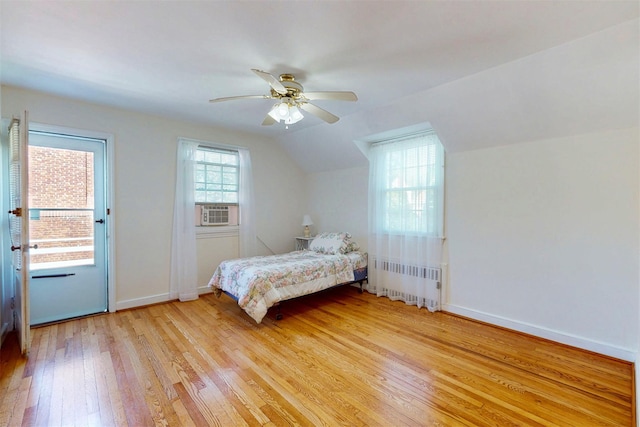 32 Biltmore Ave, Yonkers, NY 10710 - bedroom with radiator heating unit, light wood-style floors, lofted ceiling, cooling unit, and ceiling fan
