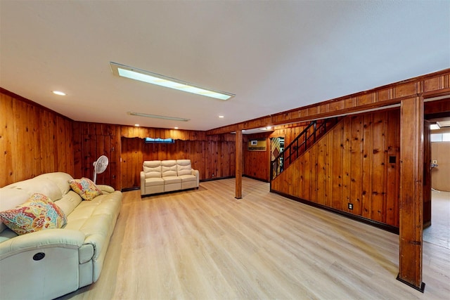 32 Biltmore Ave, Yonkers, NY 10710 - living room with wooden walls, light wood-type flooring, and stairs