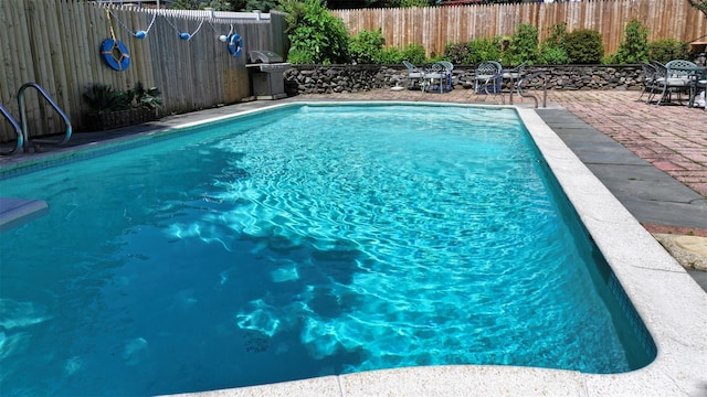 32 Biltmore Ave, Yonkers, NY 10710 - view of pool with area for grilling, a fenced backyard, and a patio