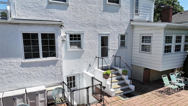 32 Biltmore Ave, Yonkers, NY 10710 - entrance to property with stucco siding and a patio