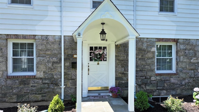 32 Biltmore Ave, Yonkers, NY 10710 - doorway to property featuring stone siding