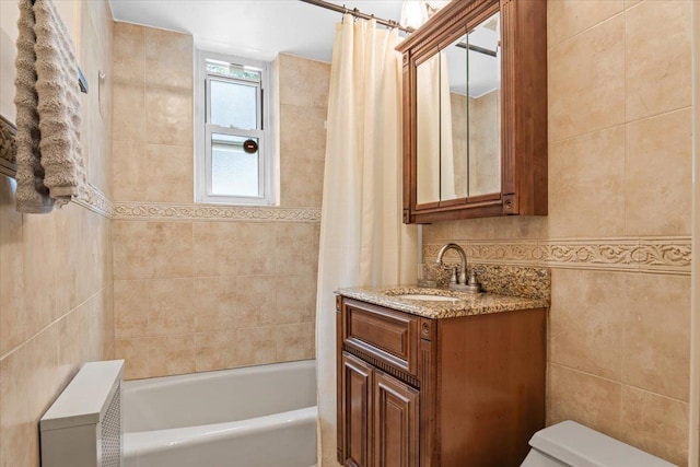 81 Edwards St Unit T, Roslyn Heights, NY 11577 - bathroom featuring tile walls, vanity, and shower / bath combo