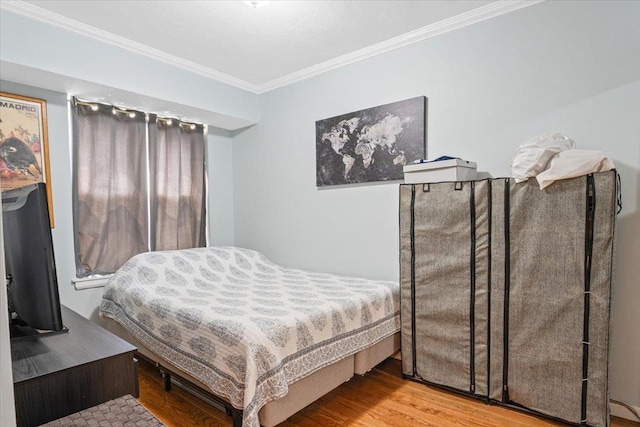 81 Edwards St Unit T, Roslyn Heights, NY 11577 - bedroom featuring crown molding and wood finished floors