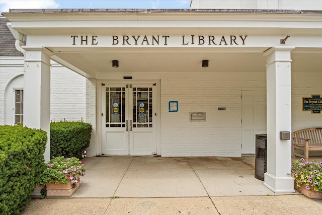 81 Edwards St Unit T, Roslyn Heights, NY 11577 - doorway to property featuring brick siding and french doors