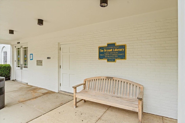 81 Edwards St Unit T, Roslyn Heights, NY 11577 - property entrance featuring brick siding