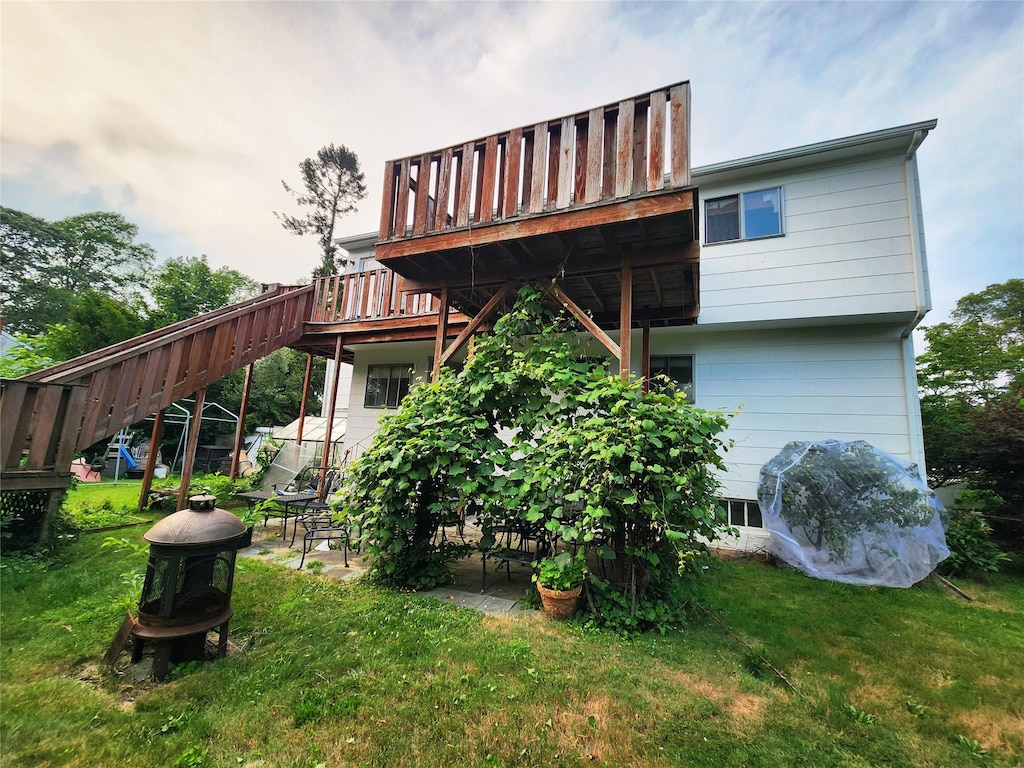 14 Brian Dr, East Islip, NY 11730 - back of house with a yard, stairs, and a deck