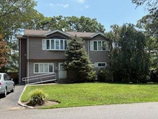 353 Litchfield Ave, Babylon, NY 11702 - view of front of home with a front lawn and asphalt driveway