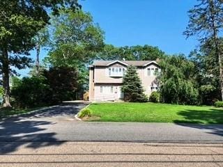 353 Litchfield Ave, Babylon, NY 11702 - view of front of home with a front lawn and driveway