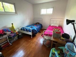 353 Litchfield Ave, Babylon, NY 11702 - bedroom featuring wood finished floors