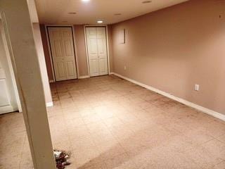 353 Litchfield Ave, Babylon, NY 11702 - unfurnished bedroom with recessed lighting and multiple closets