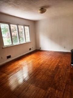 353 Litchfield Ave, Babylon, NY 11702 - empty room with hardwood / wood-style flooring and baseboards