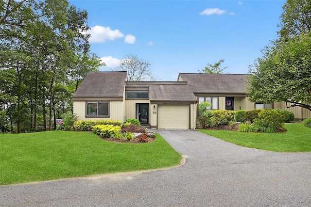 582 Heritage Hls Unit A, Somers, NY 10589 - mid-century home with driveway, a garage, a shingled roof, and a front yard