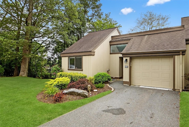 582 Heritage Hls Unit A, Somers, NY 10589 - view of front of home with a shingled roof, a garage, a front lawn, and asphalt driveway
