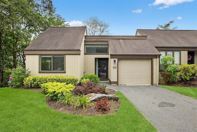 582 Heritage Hls Unit A, Somers, NY 10589 - mid-century inspired home with an attached garage, a shingled roof, a front lawn, and asphalt driveway