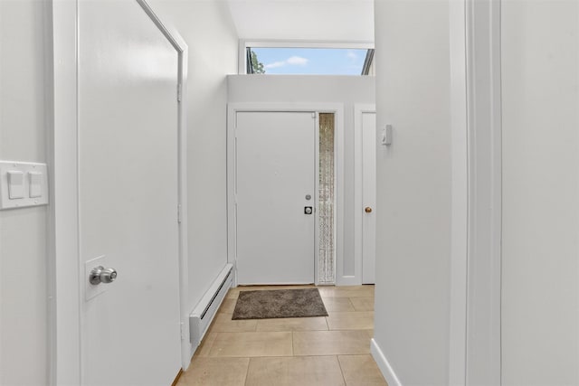 582 Heritage Hls Unit A, Somers, NY 10589 - doorway to outside featuring a baseboard heating unit and light tile patterned floors