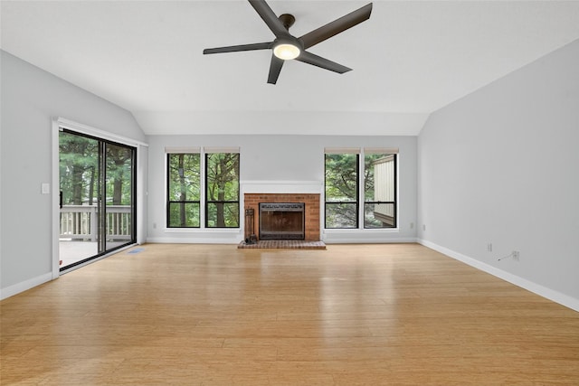 582 Heritage Hls Unit A, Somers, NY 10589 - unfurnished living room featuring lofted ceiling, plenty of natural light, light wood-type flooring, ceiling fan, and a brick fireplace