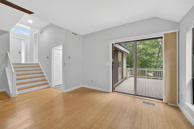 582 Heritage Hls Unit A, Somers, NY 10589 - unfurnished room with wood finished floors, lofted ceiling, stairway, and recessed lighting