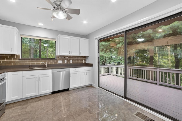 582 Heritage Hls Unit A, Somers, NY 10589 - kitchen featuring appliances with stainless steel finishes, dark countertops, backsplash, ceiling fan, and light marble finish floors