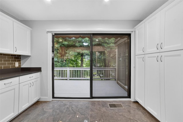 582 Heritage Hls Unit A, Somers, NY 10589 - doorway to outside with stone finish flooring