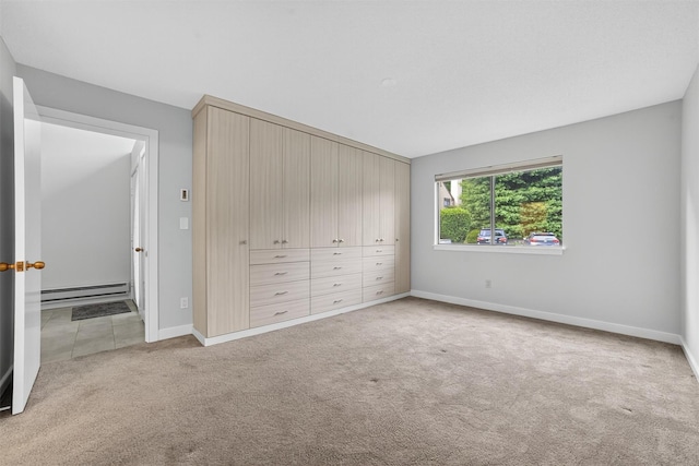 582 Heritage Hls Unit A, Somers, NY 10589 - unfurnished bedroom featuring a baseboard radiator and carpet flooring