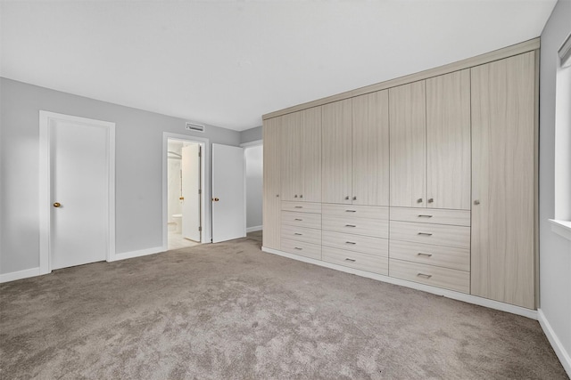 582 Heritage Hls Unit A, Somers, NY 10589 - unfurnished bedroom featuring carpet floors and connected bathroom