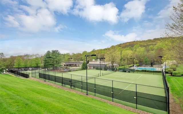 582 Heritage Hls Unit A, Somers, NY 10589 - view of tennis court with a view of trees