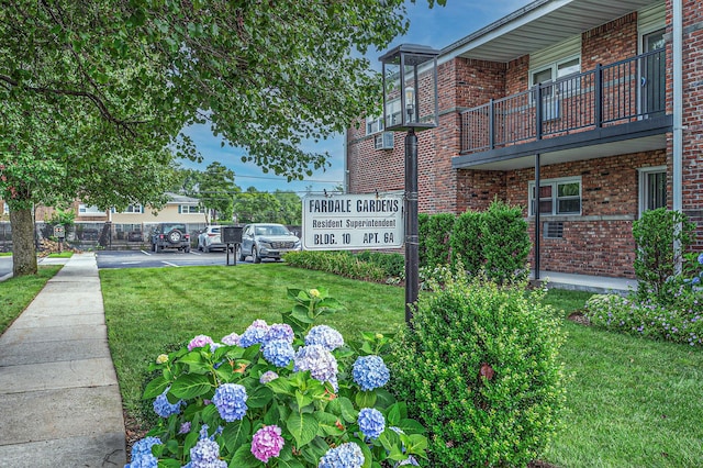 18 Ivy St Unit 4A, Farmingdale, NY 11735 - view of community with a yard and uncovered parking
