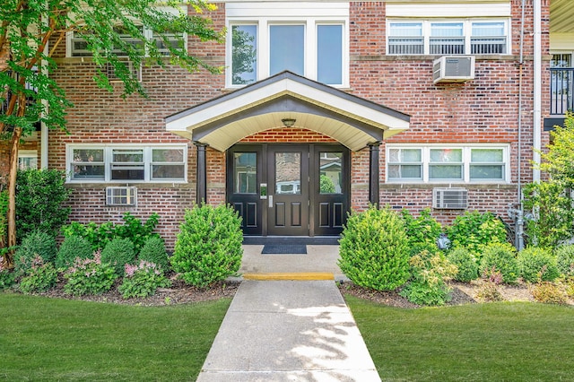 18 Ivy St Unit 4A, Farmingdale, NY 11735 - entrance to property with brick siding and a lawn