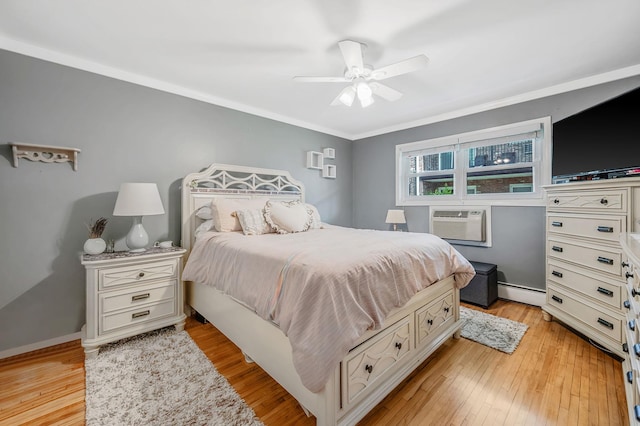 18 Ivy St Unit 4A, Farmingdale, NY 11735 - bedroom featuring a ceiling fan, light wood-style flooring, ornamental molding, and a baseboard heating unit
