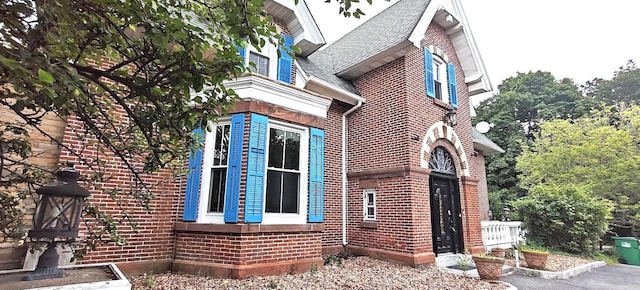 12 Monell Pl, Beacon, NY 12508 - view of property exterior with brick siding and a shingled roof